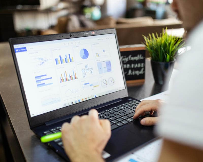 A business Analyst working from his computer